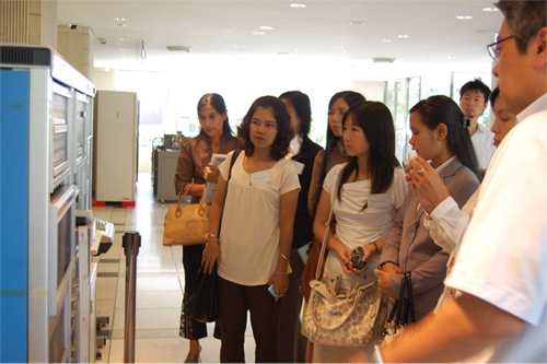 Trainees looking at a large computer