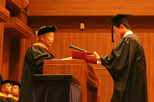 A representative of KCGI graduates receiving the degree of 