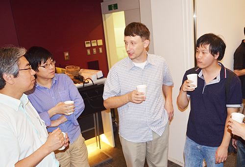 Dr. Baru Koleshnikov (center photo) interacts with students and faculty at the 