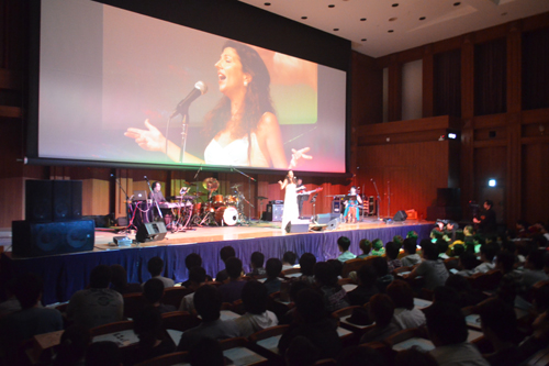 Nitza Melas sings enthusiastically at a concert commemorating the release of the KCG Group's 50th anniversary CD album 