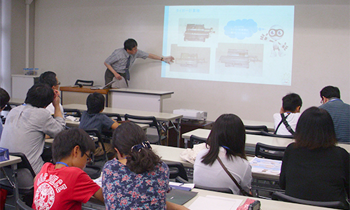 Parents and children learning about the history of computers