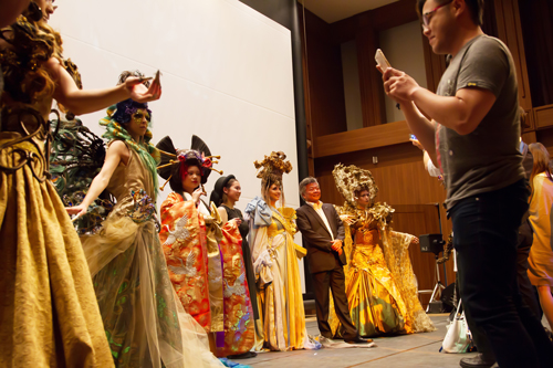 Students observe hair art and costumes up close