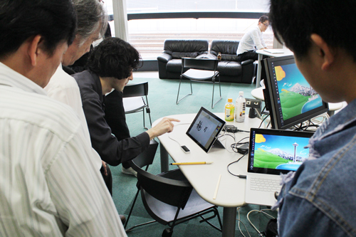 A view of the Natural User Interface booth.The photo shows a system that reads and recognizes letters written in an empty space.