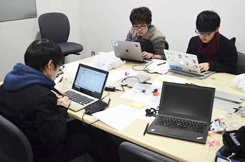 Students working on implementing their ideas at the hackathon on the 28th.