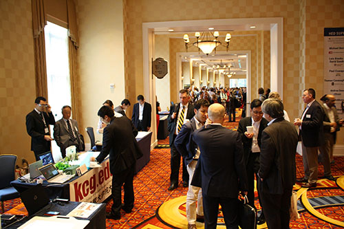 Exhibition booths crowded with participants and visitors