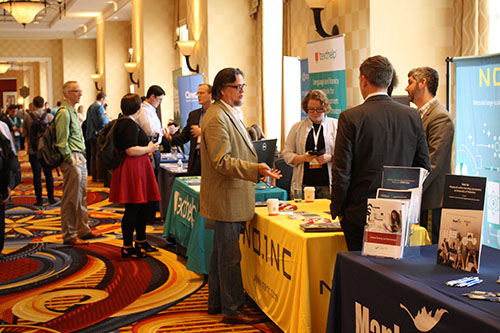 Exhibition booths of various organizations presenting various educational examples of ICT use