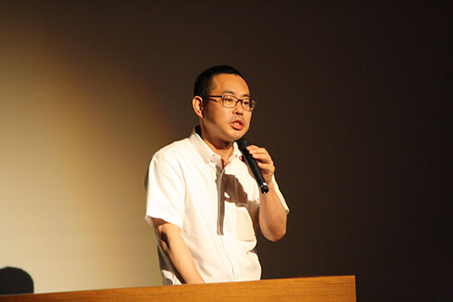 Kenji Hiranabe, President of Eiwa System Management, Inc. speaks on the front lines of agile development at KCGI Kyoto Ekimae Satellite Main Hall on June 8, 2018.