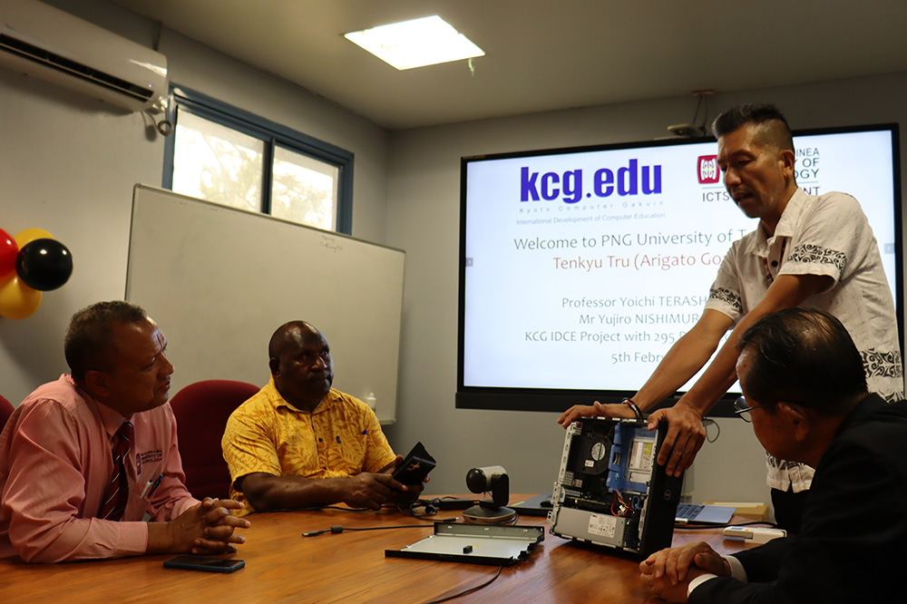 Mr. Harada, ICT Director of PNGUoT, explaining the PCs donated by KCG