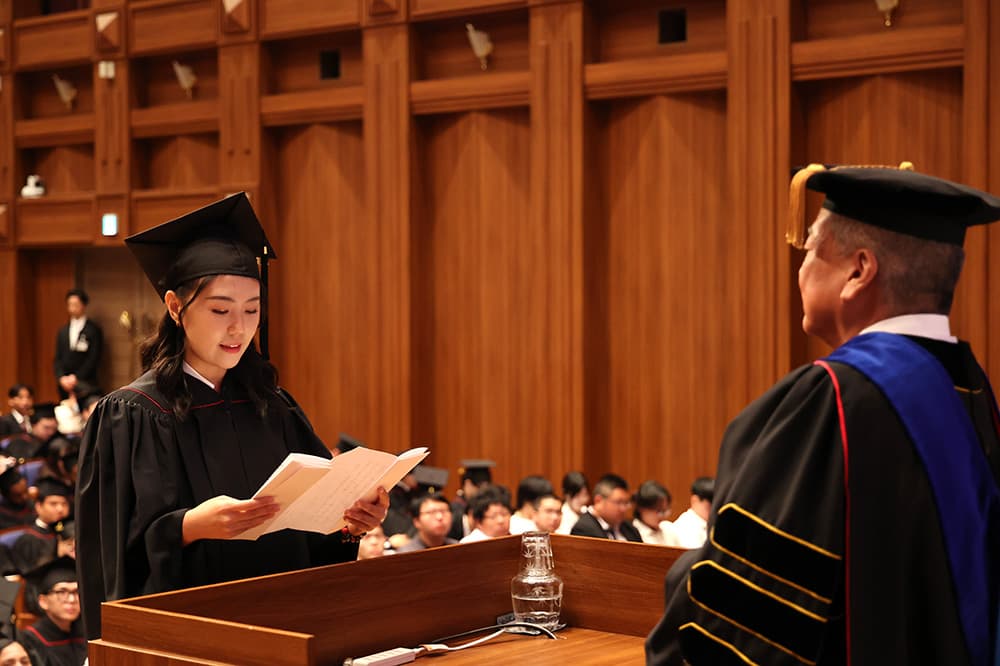 Yang, a graduate of KCGI's Graduate School of Applied Information Technology, gives his graduation/completion address (ditto, ditto).