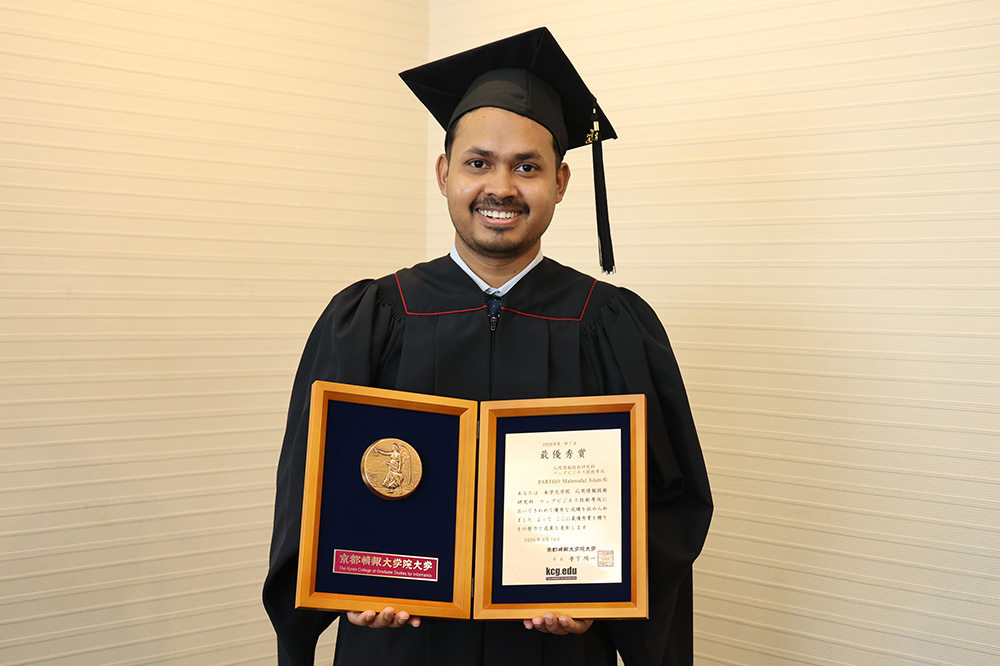 Mr. Parto, a KCGI graduate, holding the Grand Prize trophy.Mr. Parto was also selected for the Outstanding Project Award.