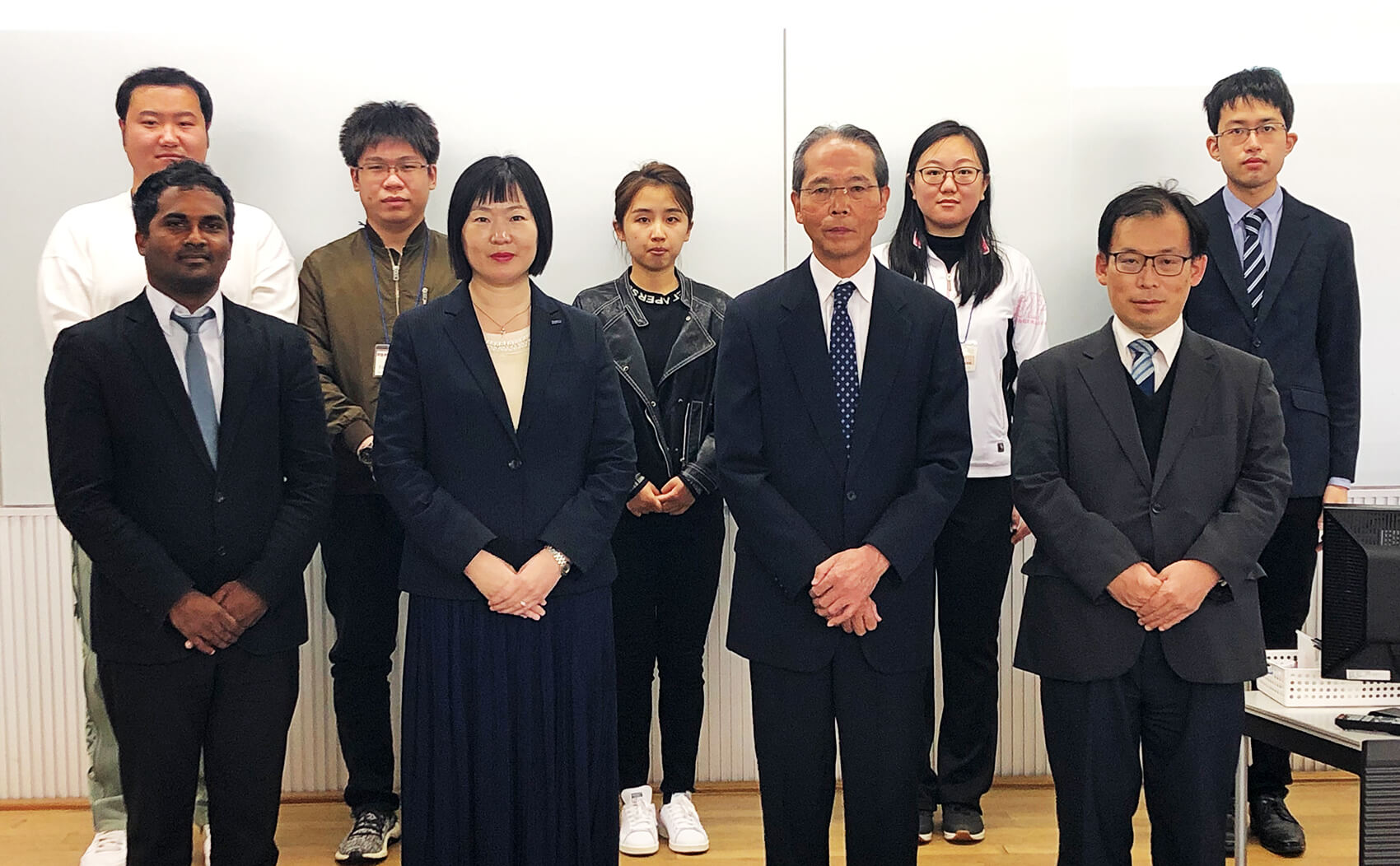 Students in the ERP program and their instructors pose for a photo.